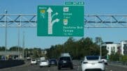 Building networks of managed lanes in big cities to reduce traffic congestion
